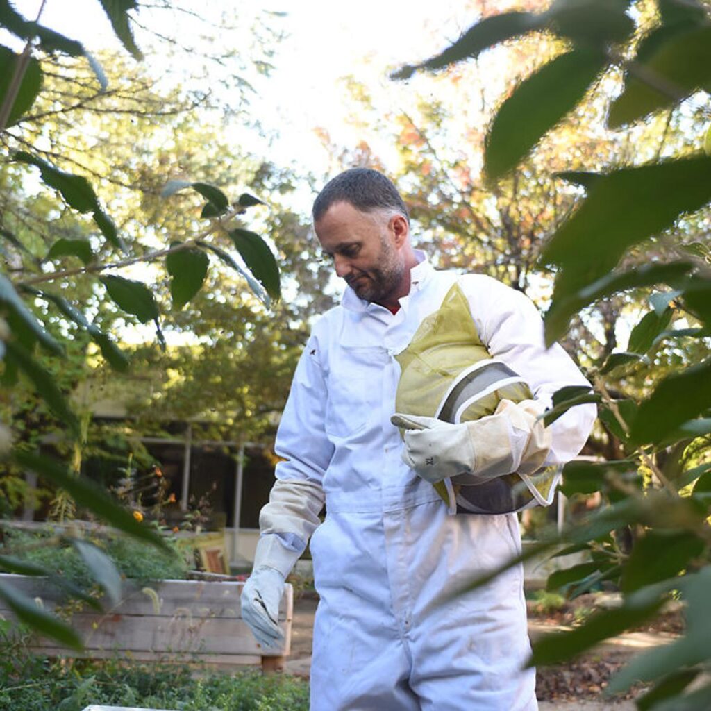 man in beekeeping suit at Fairview Elementary