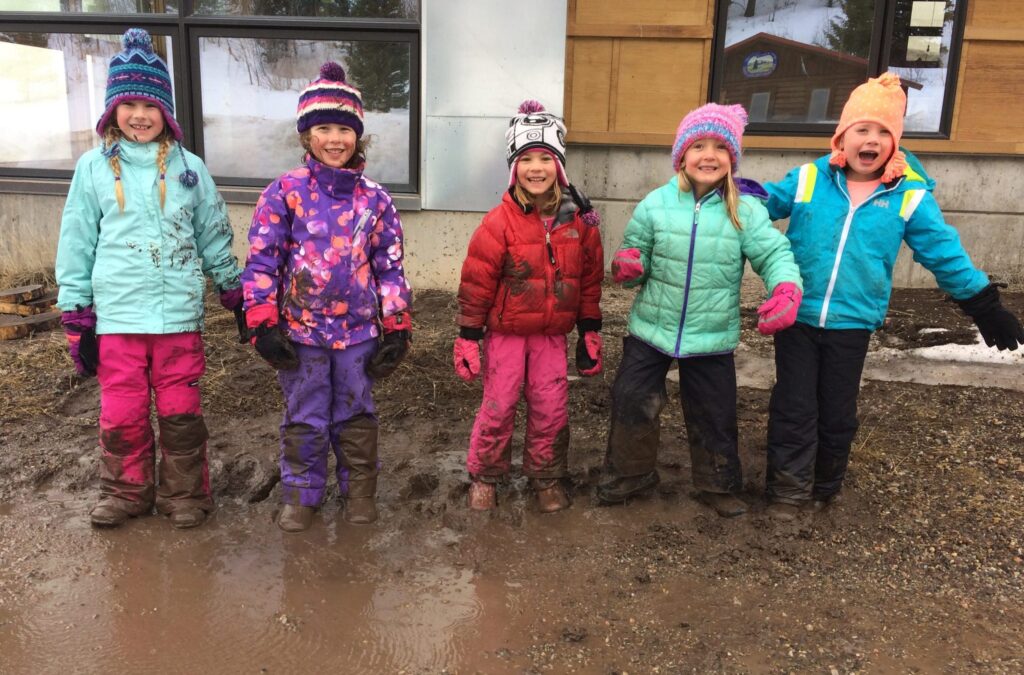 kids outside playing in the mud